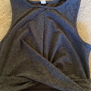 It’s a size small dark grey crop top. Has a knot size on the front.